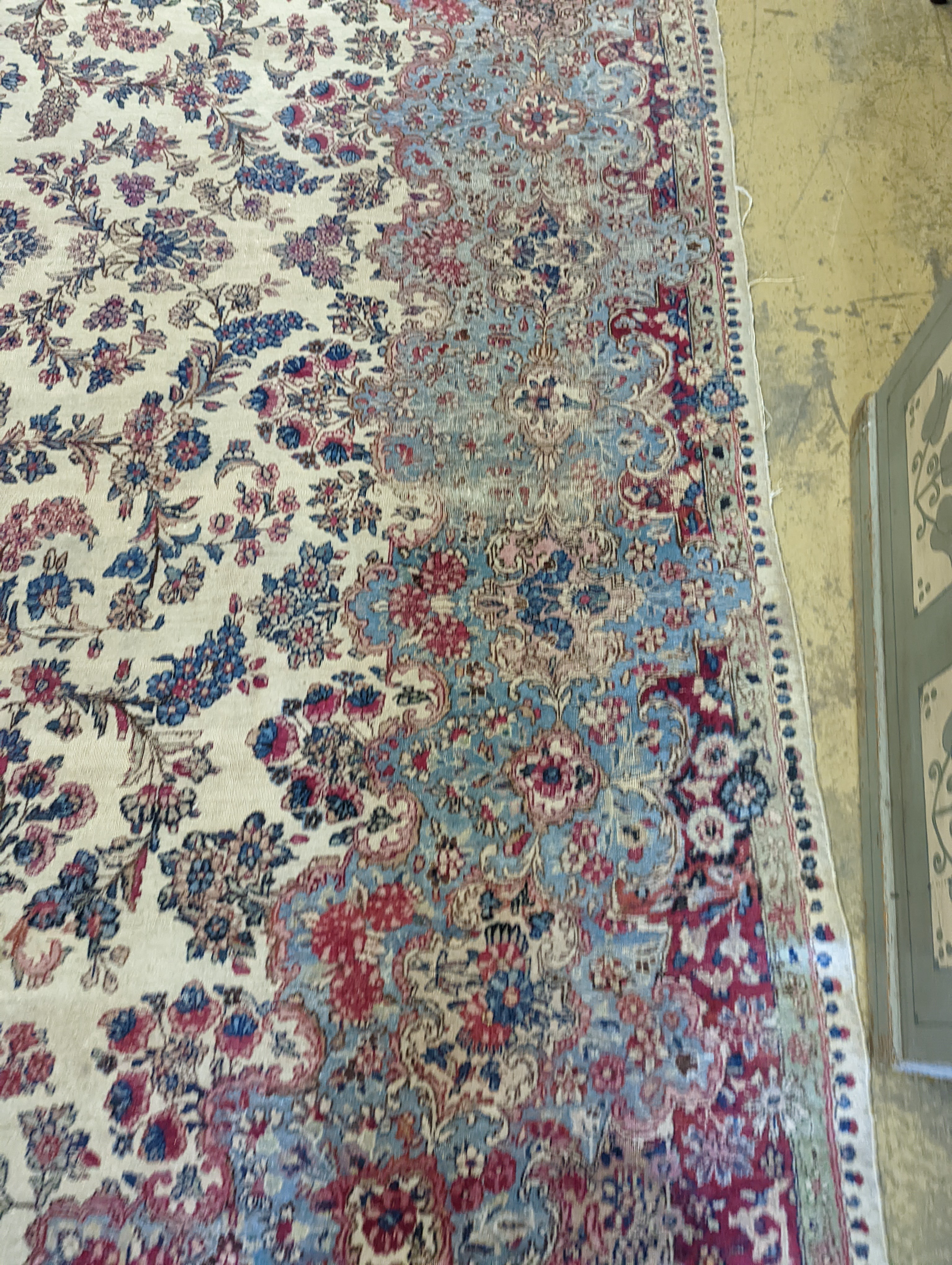 A North West Persian ivory ground carpet, 396 x 290cm